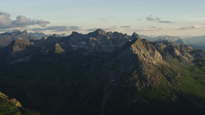 Aerial view of mountain ranges at dawn