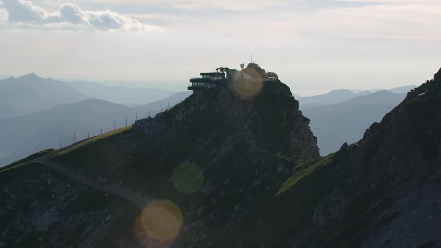 Aerial view of building on top of steep mountain
