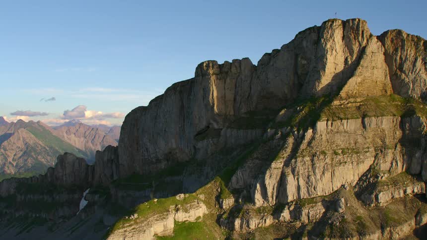 A mountain ridge under a clear blue sky