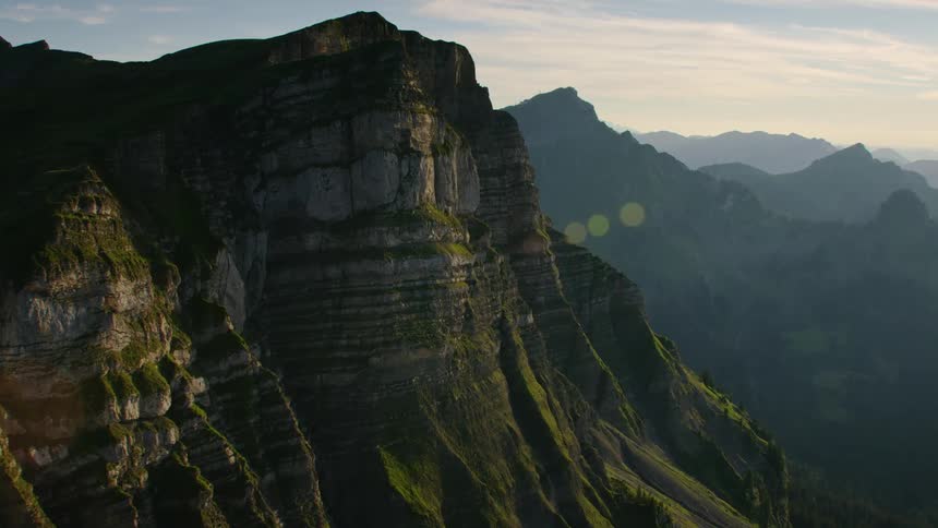 Aerial view of the steep cliffs of a mountain at morning