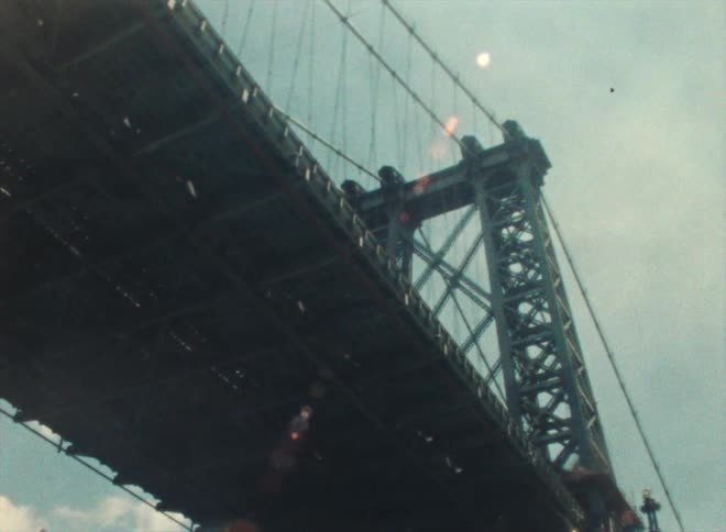 Passing under the manhattan bridge in new york caught on vintage film