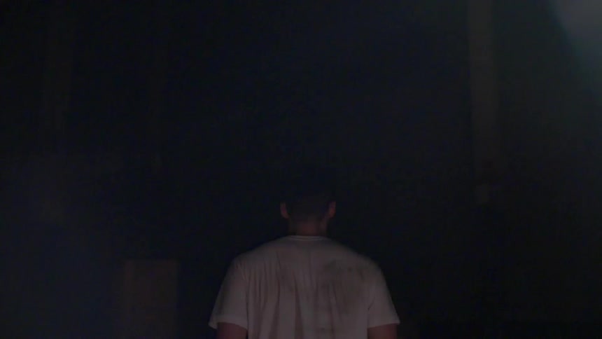 A man walks into the dark vanishing