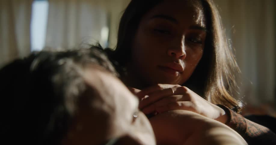 Two people laying around in a room