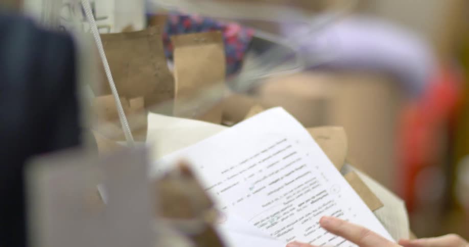 A woman examines some papers