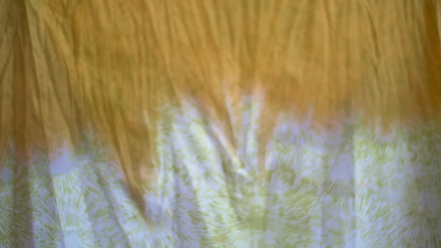 White and orange fabric hangs on something