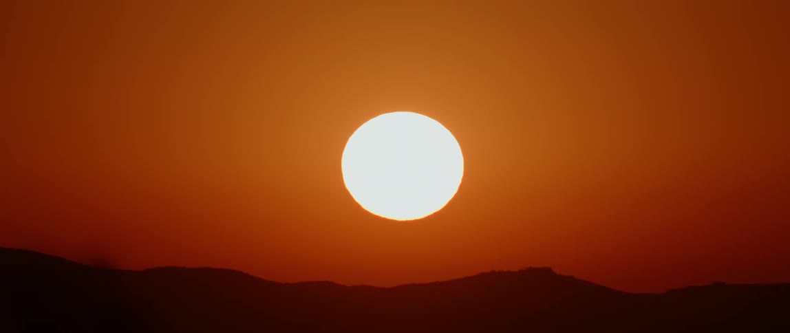 The sun sets over a mountain range in big bend national park