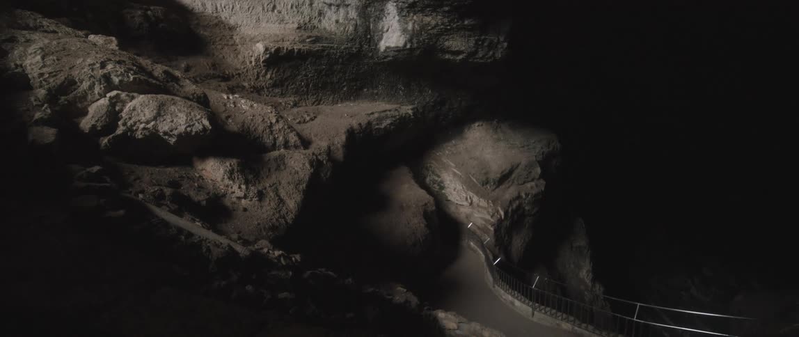 A view of a canyon with caves
