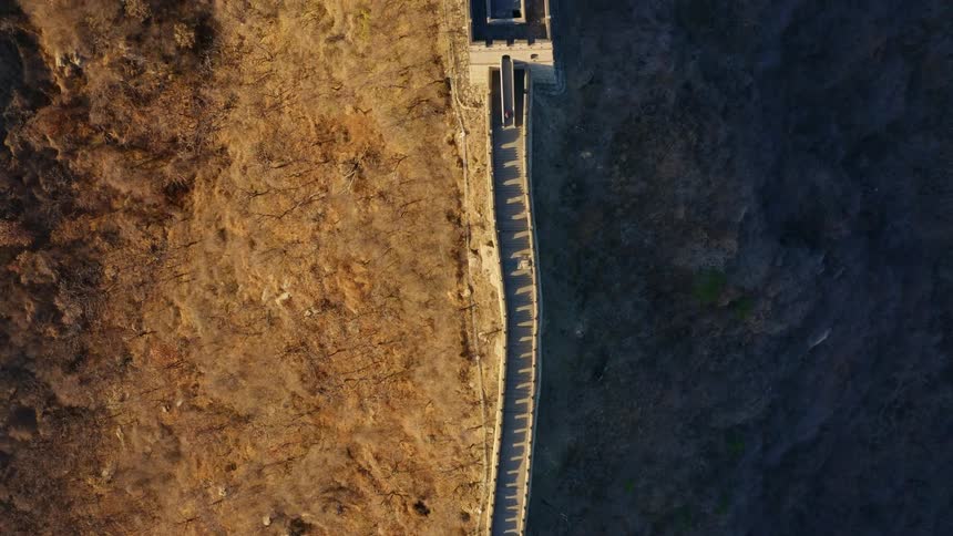 A drone shot of the Great Wall of China during sunset