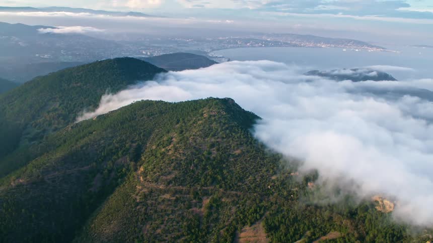 Clouds against a mountainous shoreline in the Côte d'Azur, the French Riviera in the South of France, in Cannes, Nice, and Saint-Tropez