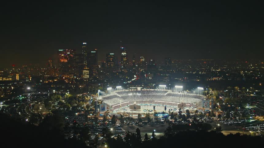 Fireworks explode in the distance as Los Angeles sports fans celebrate the 4th of July