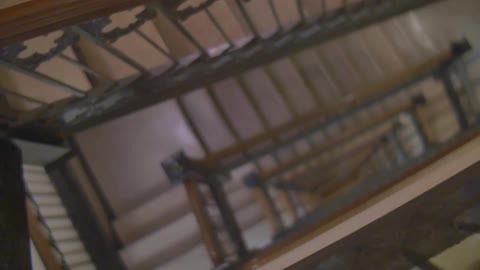 A large staircase has many floors going down