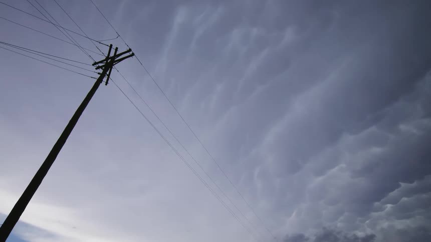 Dark Mammatus severe storm clouds rotate and boil in the afternoon supercell storm in southern New Mexico