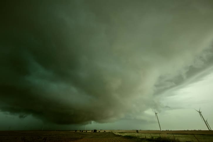 Lightning flashes can be seen as a time lapse passes directly over the camera rotating and swirling as the storm passes over