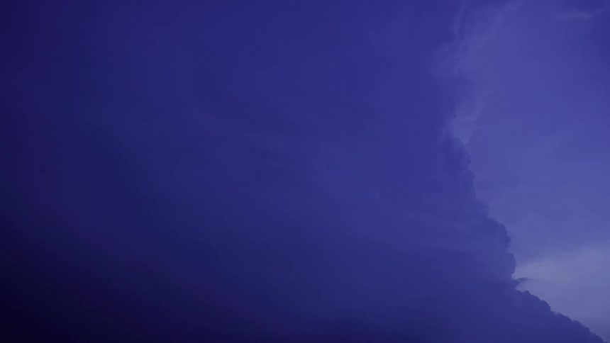 Severe storm cloud time lapse of a cumulous tower rising and building in the blue hour evening light