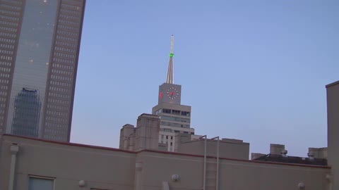 A building with a block on it is in a clear sky