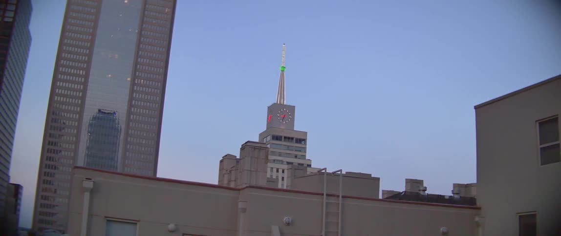 A building with a block on it is in a clear sky