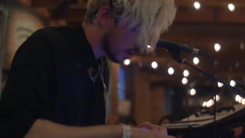 A dj is playing some music on stage