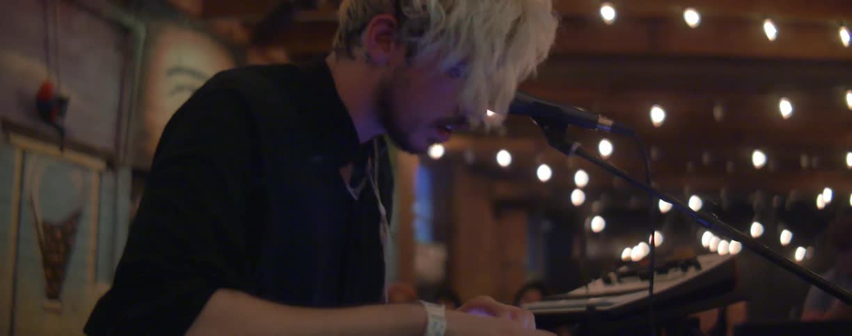 A dj is playing some music on stage