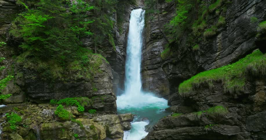 The view is of a waterfall located in the nature area