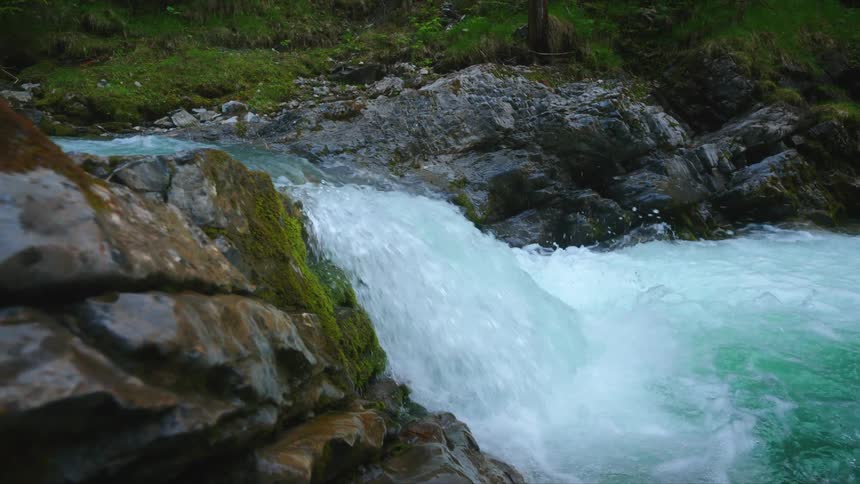 Water sparkles and splashes as it flows over the waterfalls