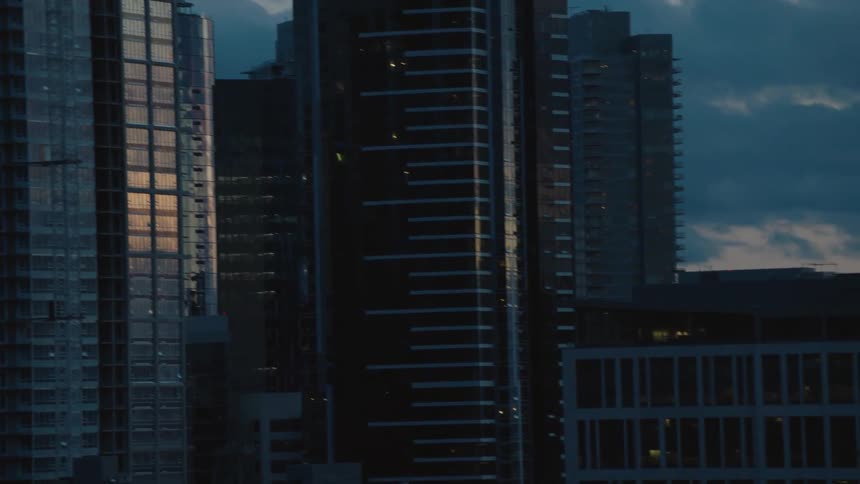 Aerial view of buildings in a downtown city is displayed