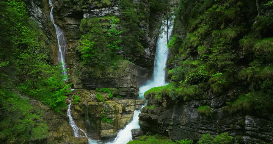 A flowing waterfall in a lush green paradise