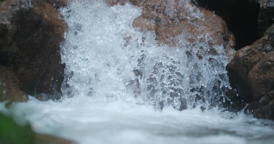 Water sparkles and splashes as it flows down the waterfalls