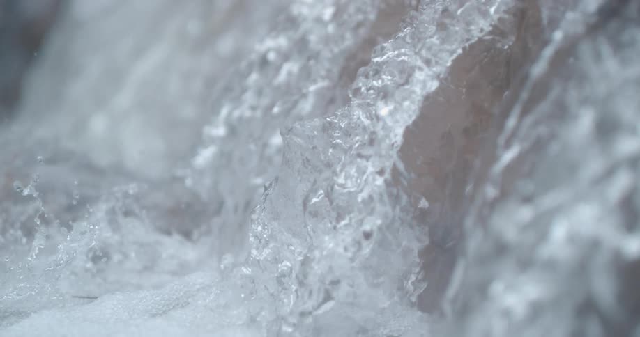 Waterfall splashes into the water below