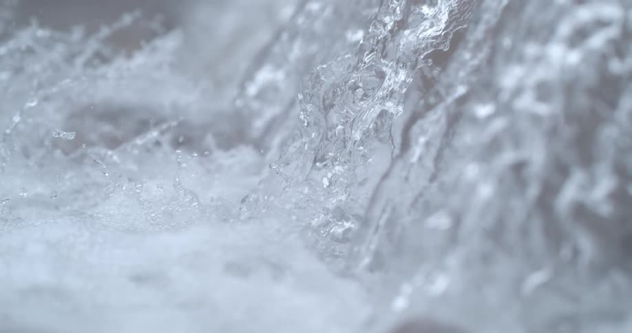 The view is of the ocean and water is splashing