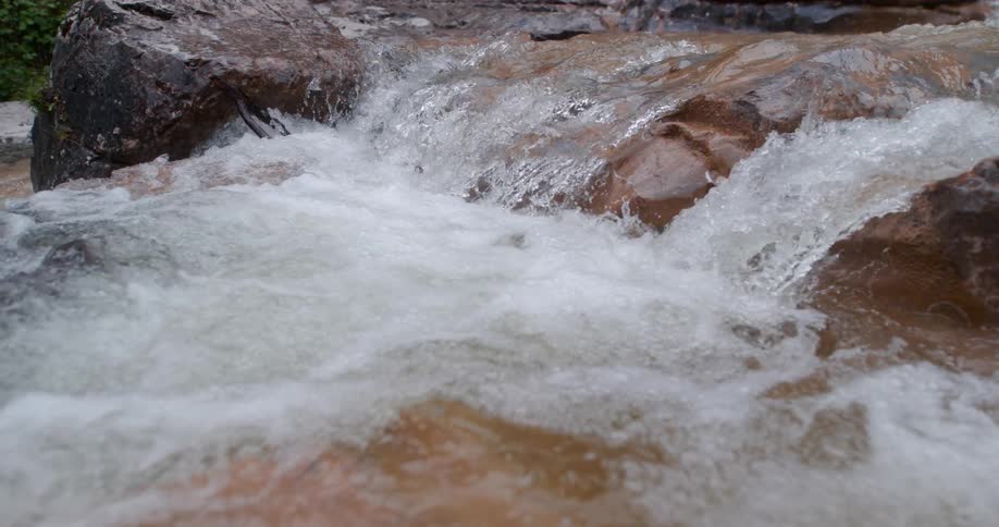 A view of a river with rocks in it