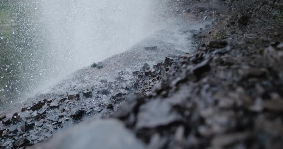 Slow motion view of rain pouring on the coast is displayed