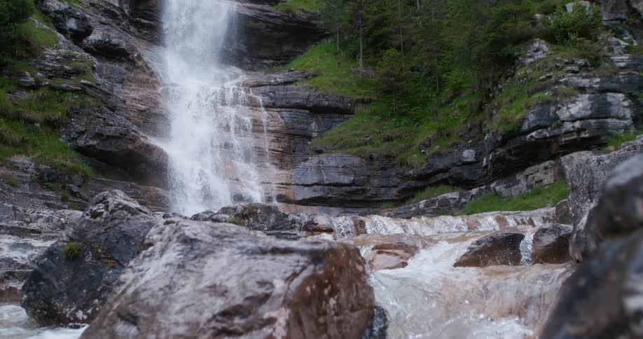The view is of a water stream that is located in the forest area