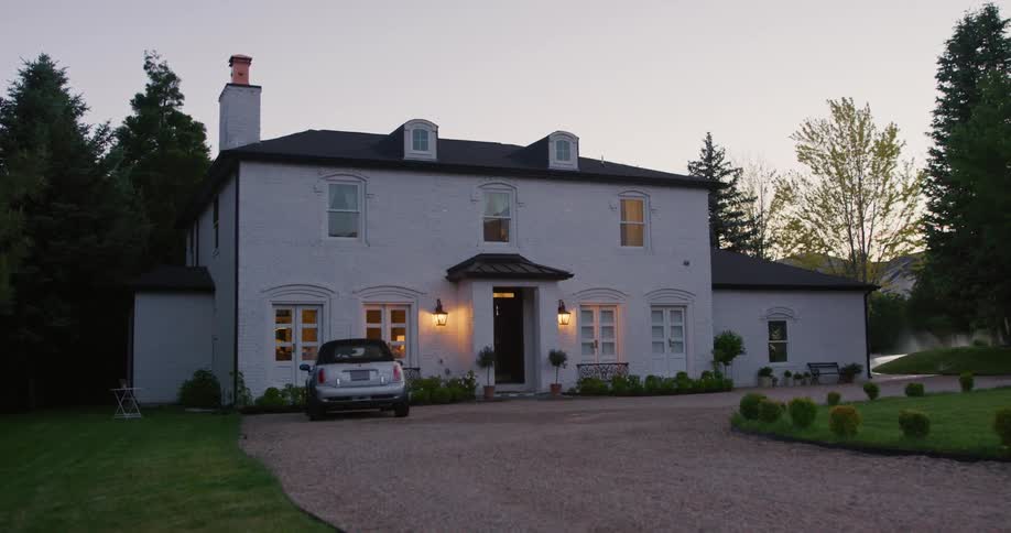 A house is located in the country area in the middle of the day