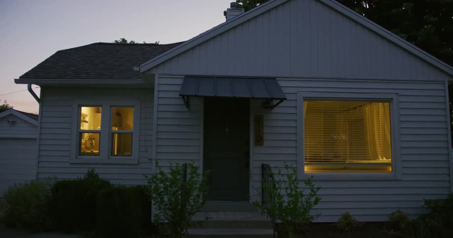 The light on the front of the house turns on then turns off at night