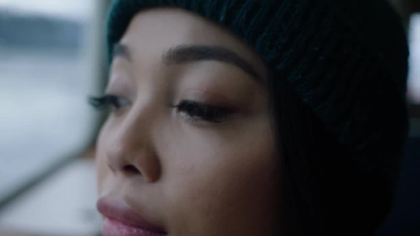 Close up view of a womans face is displayed