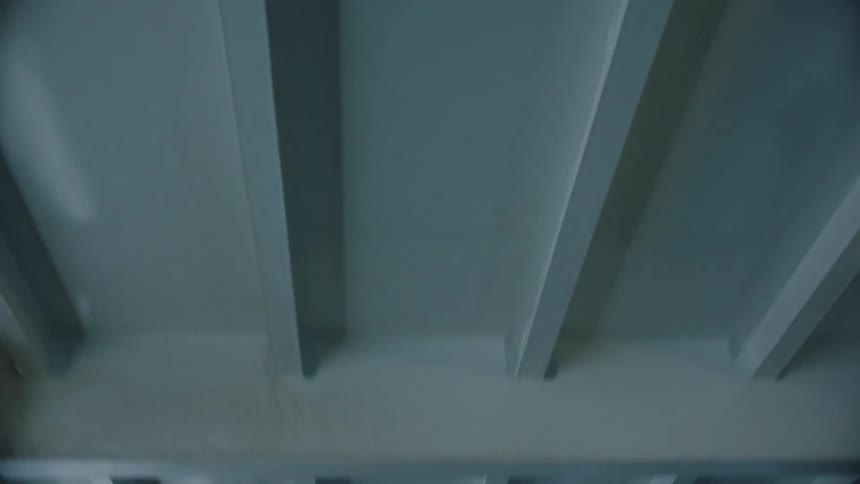 A vehicle driving under a bridge