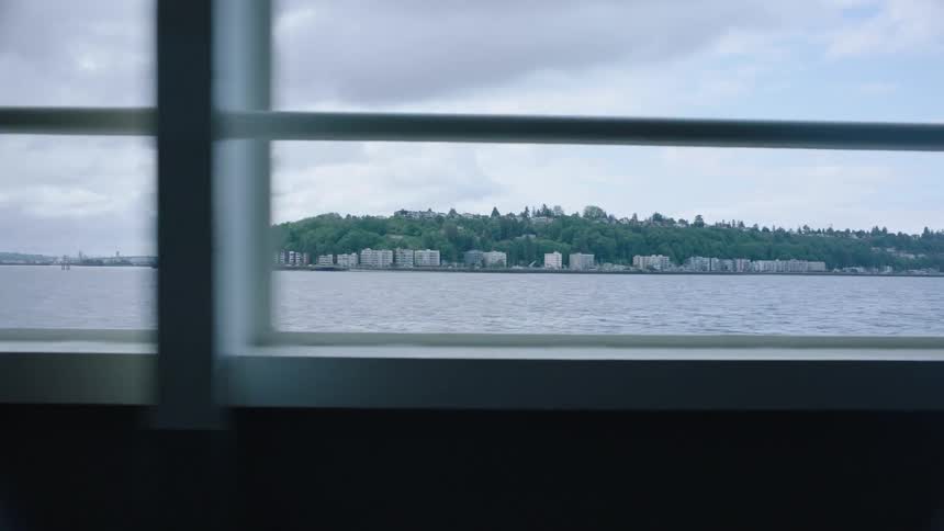 There is someone in a subway and you can see the view of a lake