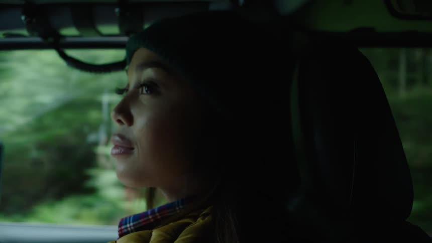 A woman riding in a car