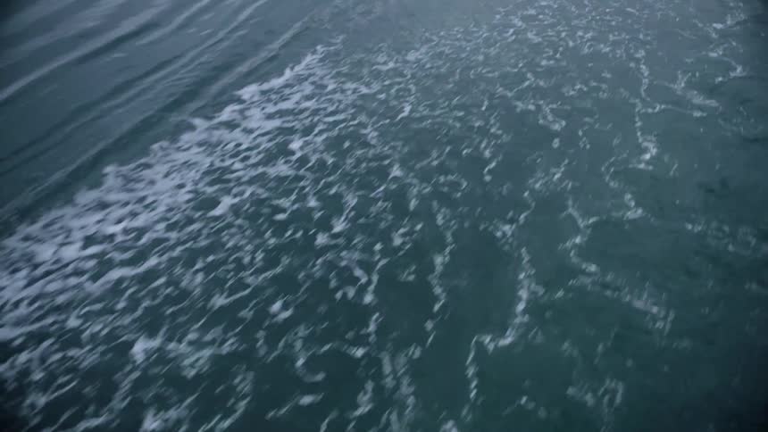 The view is of the ocean waves in the middle of the day time