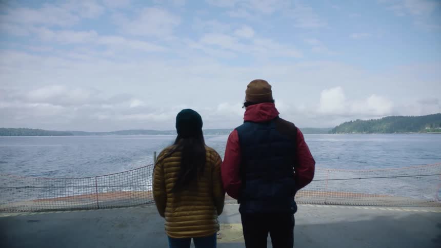 Two people are riding the ferry