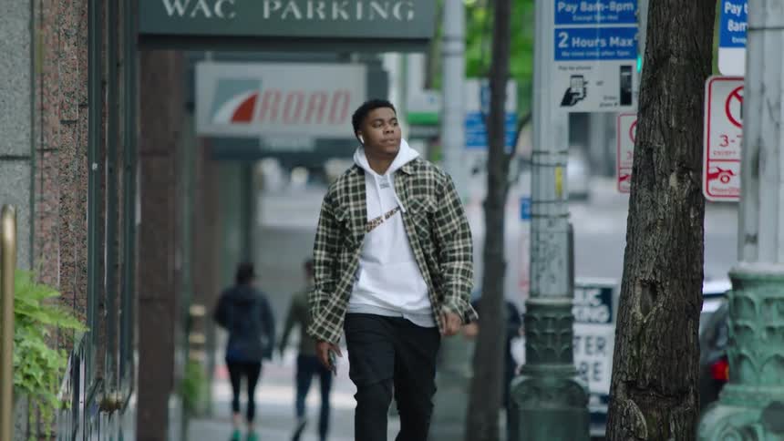 People are walking downtown in the day time