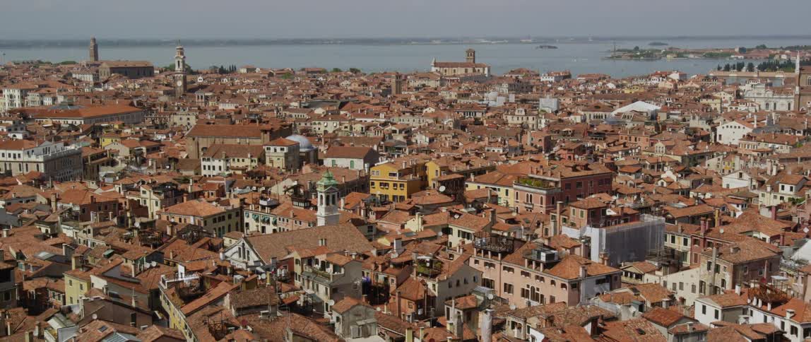Aerial view of houses in a city is displayed during midday