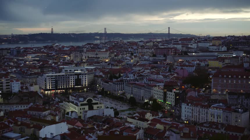 The view is of a downtown city and skyline in the evening