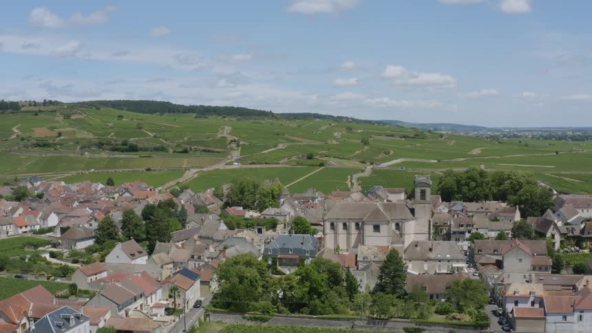 The view is of a bunch of houses located in the country side