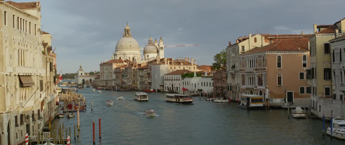 Boats travel in the canal through the city