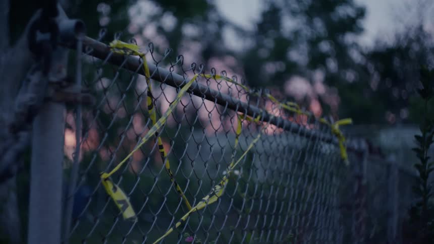 Close up view of a fence in a neighborhood is displayed