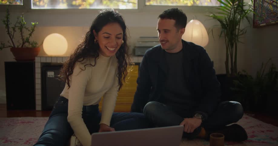 Two friends are hanging out with each other indoors