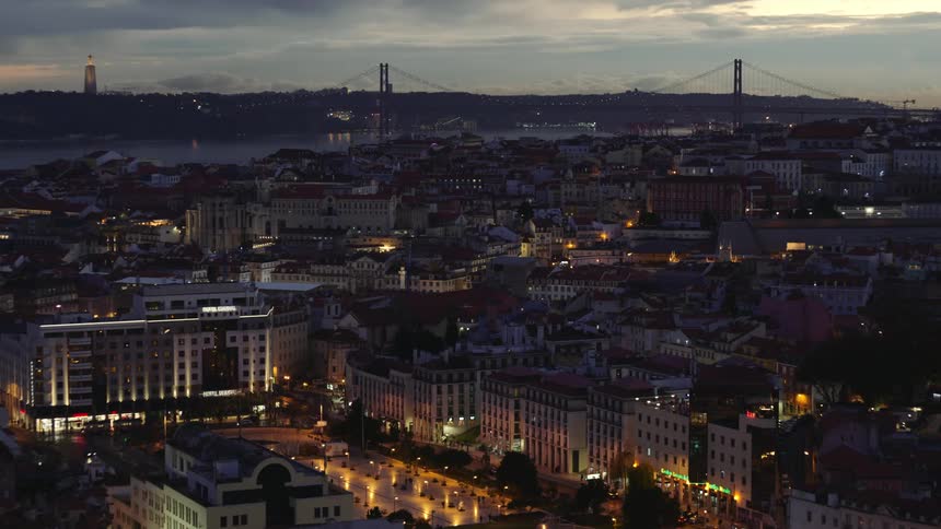 A view buildings in a downtown city is displayed at dusk