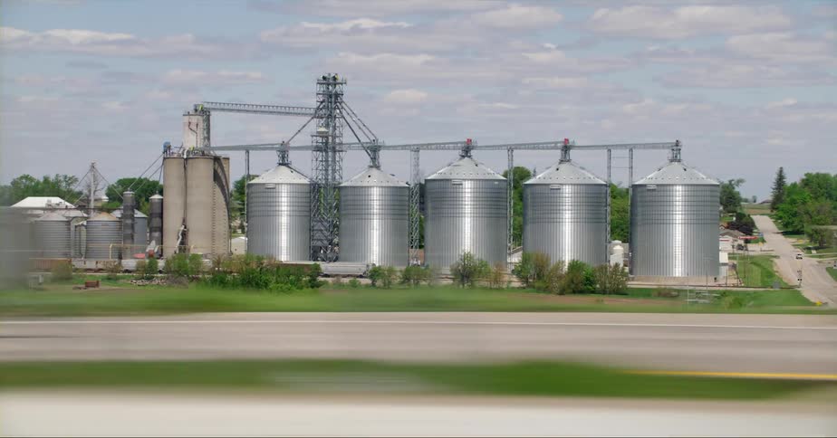 Row of grain bins and an elevator in an agricultural community
