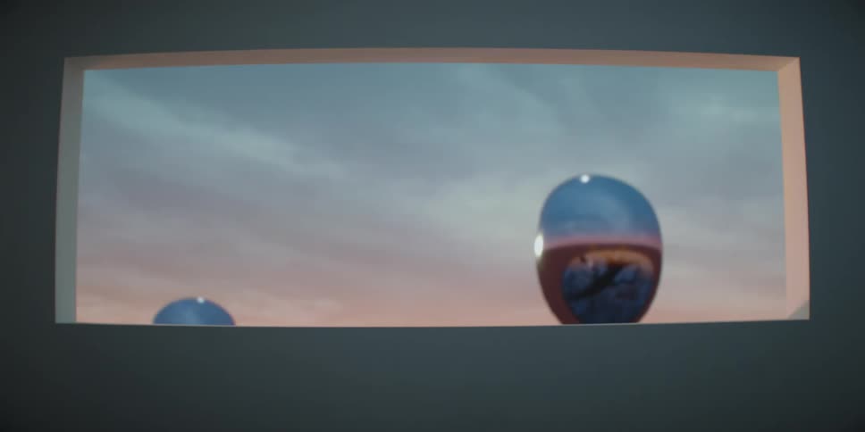 Futuristic technology is displayed outdoors at dusk